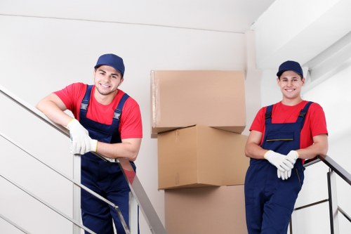Staff following safe storage procedures in a warehouse setting