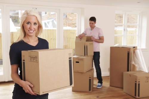 Professional movers handling furniture during a Crossness house move