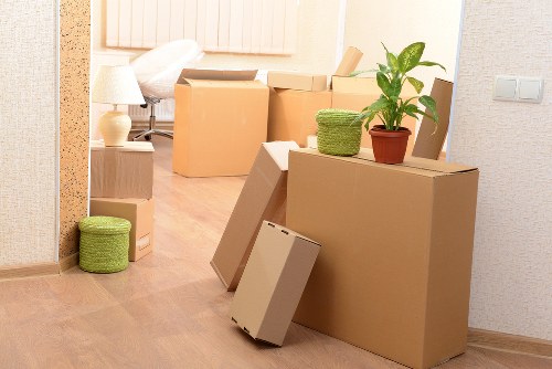 Professional movers handling tight access in a Crossness flat