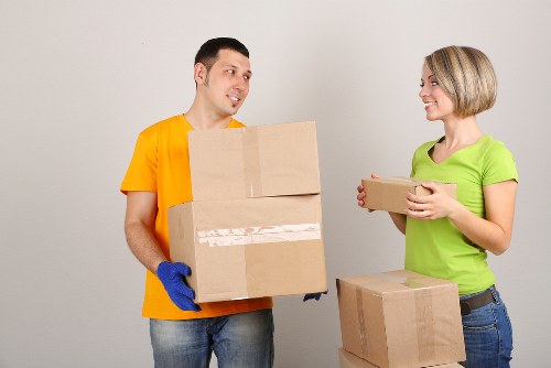 Professional moving team preparing items for delivery in Crossness